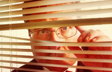 Micromanaging boss watching through blinds