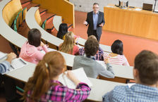 Professor and students in college lecture hall