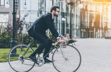 businessman riding his bicycle to work