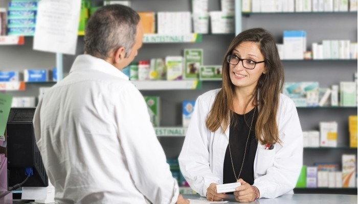 Pharmacist with client